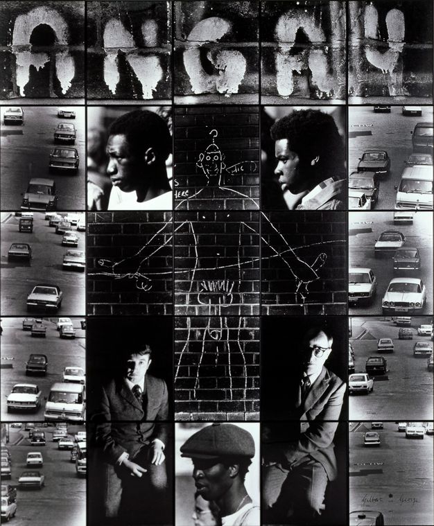 Mixed media. Twenty-five black and white photographs, each in a thin black frame, are arranged in a grid of five by five. The central five are arranged in a cross and together show a chalk outline of a man with an oversized phallus drawn on a brick wall. Letters in the top row of images spell “angry”. Other images are of traffic or men with either dark skin or pale skin. 